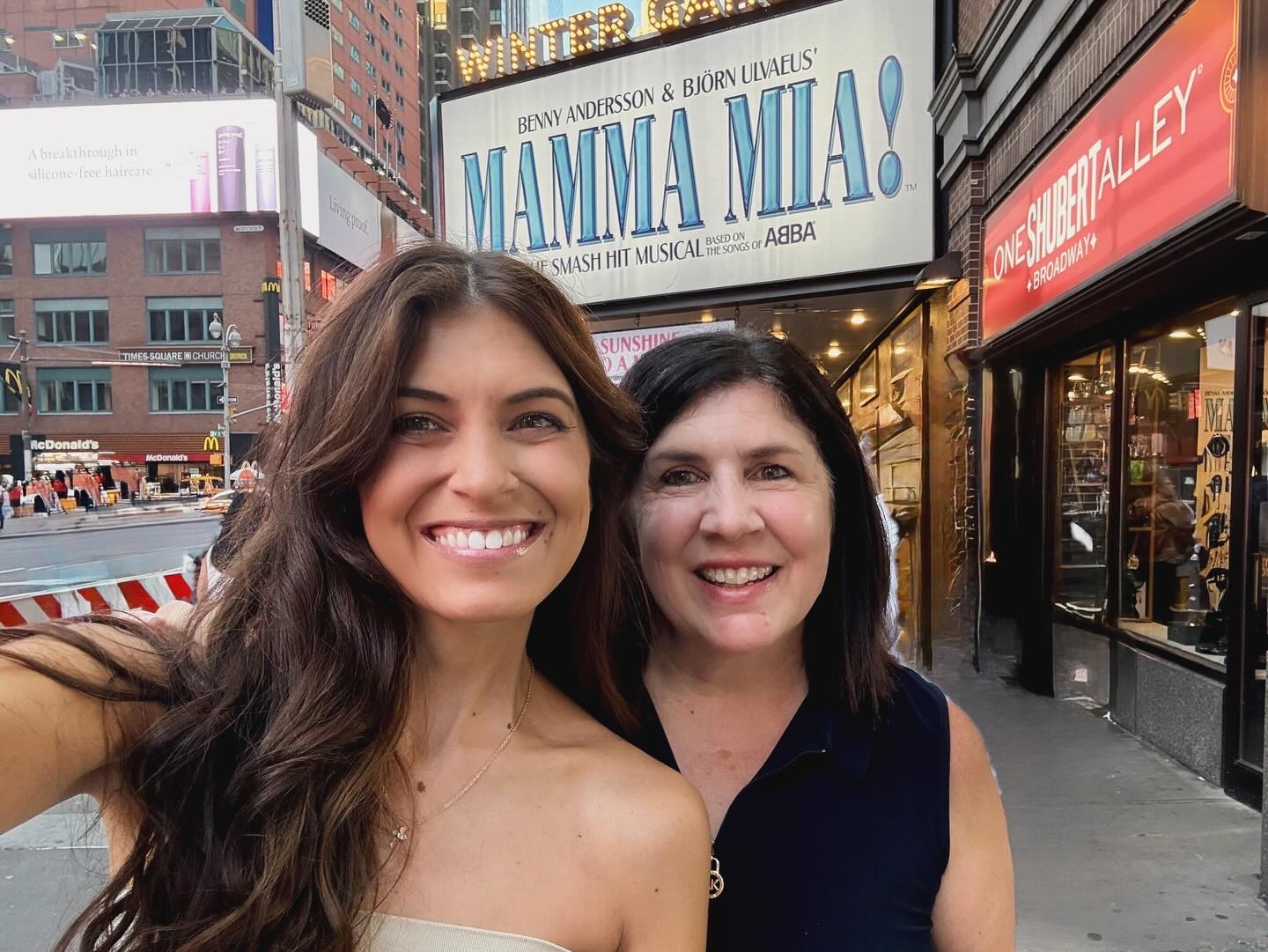Two members of the Wahi Pono family smiling together in New York City