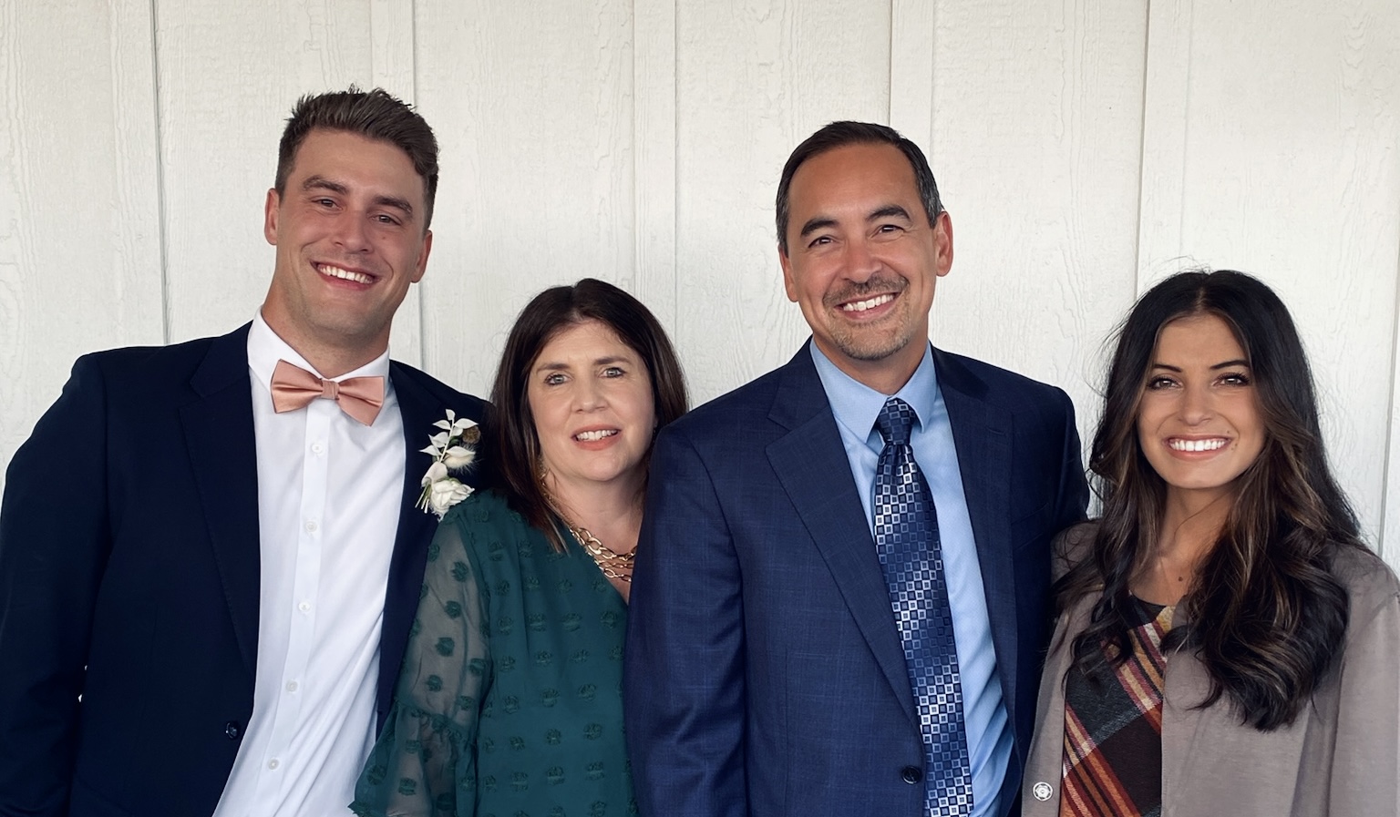 The Wahi Pono family dressed up together at a family wedding
